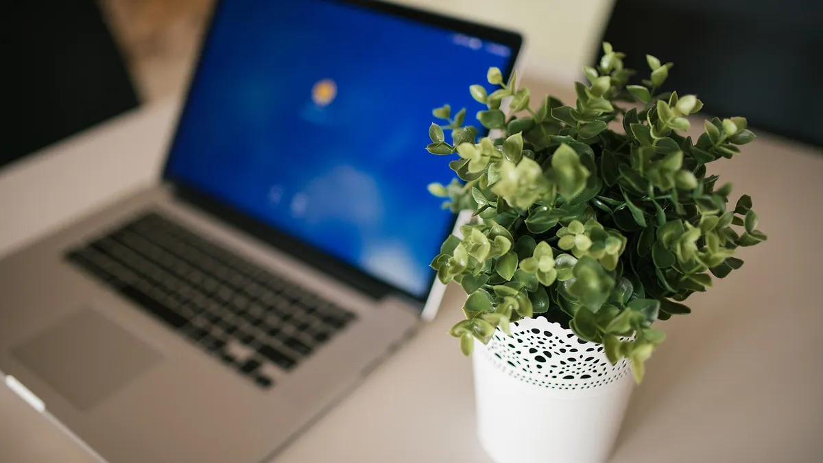Laptop on a desk in a daylight workspace