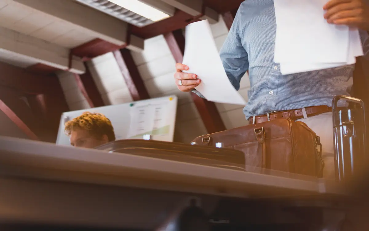 Businessman reviewing paper documents at a desk