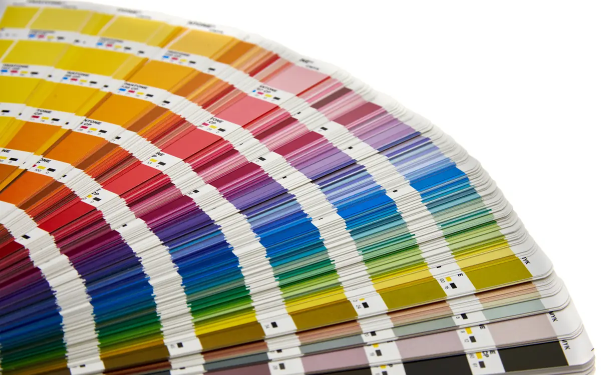 Fanned-out colour swatch book with a rainbow of shades