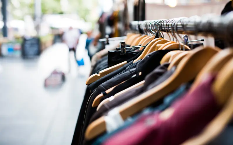 Shirts and jackets on hangers in a clothing store