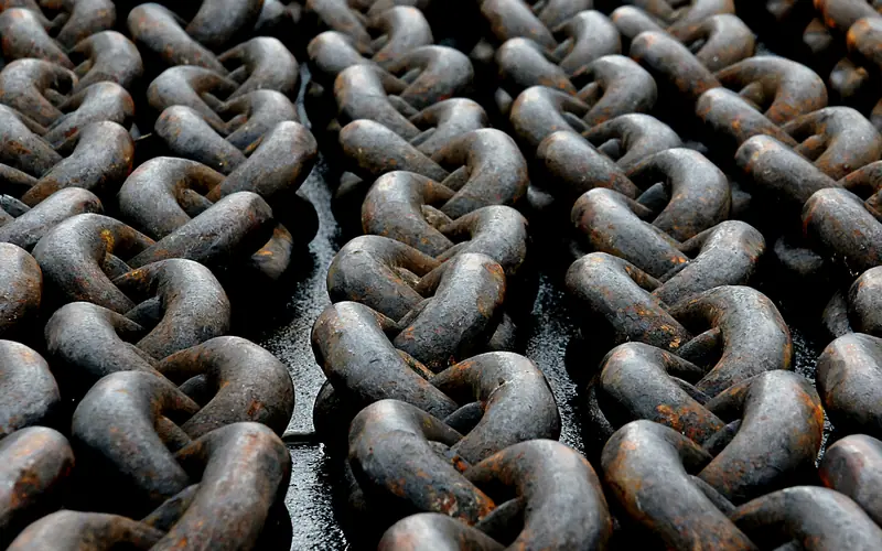 Close-up of heavy interlocking metal chain links