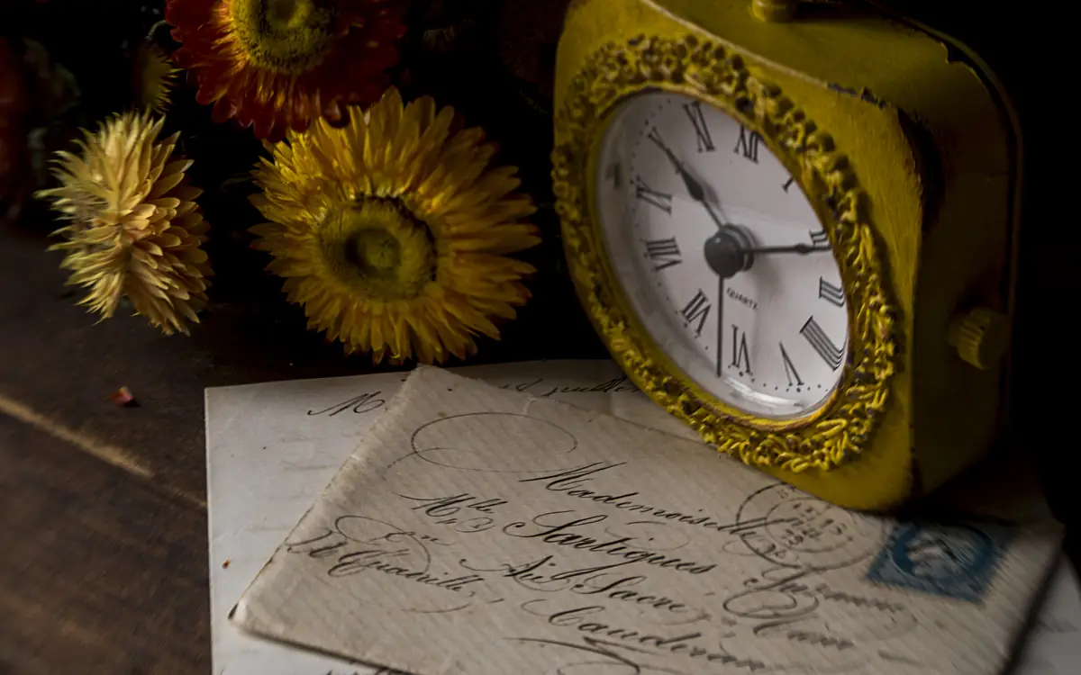 Antique clock beside a handwritten letter