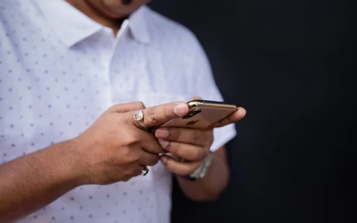 Man scrolling on his smartphone