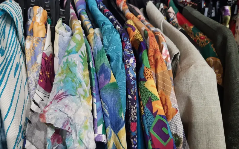 Rail of patterned vintage clothing in a second-hand shop