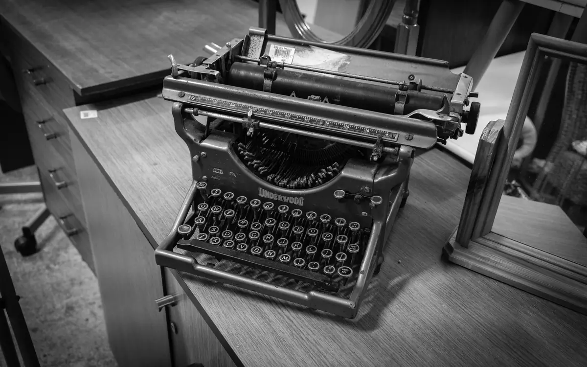 Black-and-white close-up of an antique typewriter